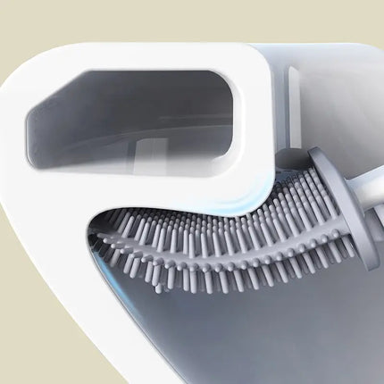 Toalettborste med platt silikonhuvud och skål med botten